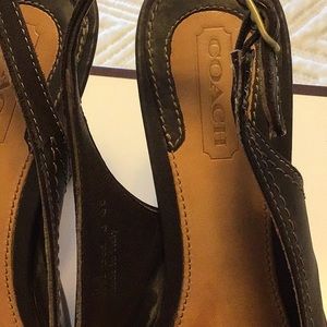A pair of coach shoes in very good condition